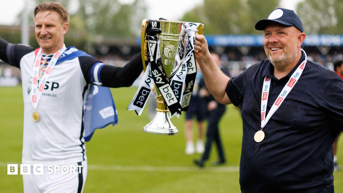 Byron Webster and Andy Woodman with the League Two trophy