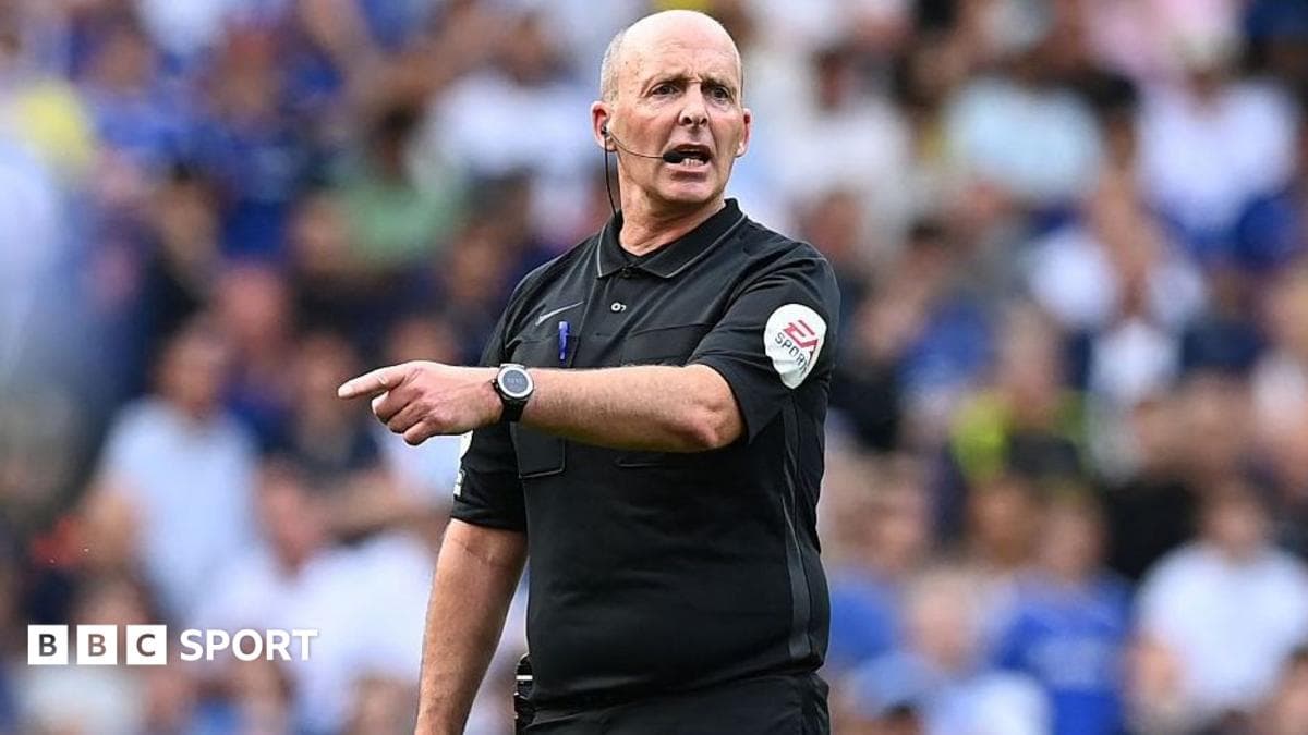 English referee Mike Dean gestures during the Premier League match between Chelsea and Watford