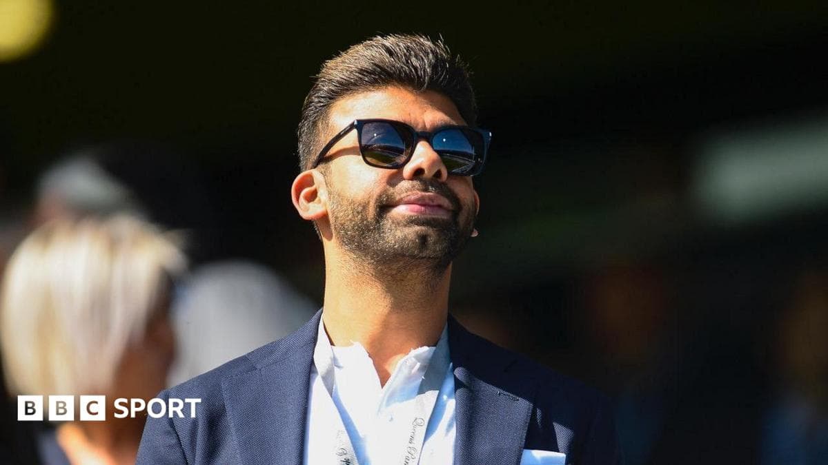 Amit Bhatia looks on from the Loftus Road directors' box during a Championship match