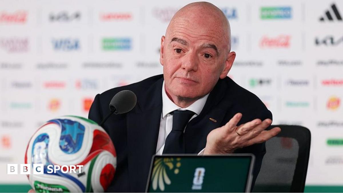 Gianni Infantino pictured at a news conference at the 2026 Fifa World Cup in front of a football